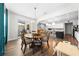 Dining area with a round table, chairs, and sliding glass doors to the patio at 3144 Dark Sky Dr, Harmony, FL 34773