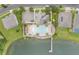 Aerial view of community pool, splash pad, and pier on a large lake at 3212 Preserve Dr, Orlando, FL 32824