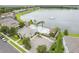 Aerial view of community center, pool, and large lake with fountain at 3212 Preserve Dr, Orlando, FL 32824