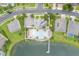Aerial view of lakefront community pool and dock with ample parking for residents at 3212 Preserve Dr, Orlando, FL 32824