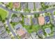 Overhead view of residential homes with well-maintained lawns and tree-lined streets at 3212 Preserve Dr, Orlando, FL 32824