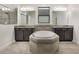 Luxurious bathroom featuring dual sinks, a soaking tub, a separate shower, and elegant finishes at 3212 Preserve Dr, Orlando, FL 32824
