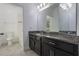 Bathroom featuring granite counters, dark brown cabinets, and a tiled floor at 3212 Preserve Dr, Orlando, FL 32824