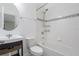 Bathroom with a tub and shower combination and round mirror above a vanity at 3212 Preserve Dr, Orlando, FL 32824