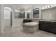 Spa-like bathroom with a soaking tub, tiled shower, dual vanities, and modern fixtures at 3212 Preserve Dr, Orlando, FL 32824
