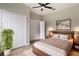 Modern bedroom with hardwood floors, spacious closet, and stylish decor, perfect for relaxation at 3212 Preserve Dr, Orlando, FL 32824