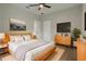 Spacious bedroom with hardwood floors, a large window, and minimalist decor for a serene ambiance at 3212 Preserve Dr, Orlando, FL 32824