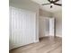 Bedroom with laminate flooring, ceiling fan, and double closets for ample storage at 3212 Preserve Dr, Orlando, FL 32824