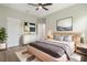 Well-lit bedroom with hardwood floors, a large window, and minimalist decor for a serene feel at 3212 Preserve Dr, Orlando, FL 32824