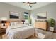 Bright bedroom with hardwood floors, featuring a large window and stylish decor for a cozy feel at 3212 Preserve Dr, Orlando, FL 32824