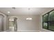 Open dining area with modern chandelier and tile flooring that provides an inviting space at 3212 Preserve Dr, Orlando, FL 32824