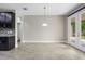 Dining room with tiled floor, light fixture, and double doors leading to patio at 3212 Preserve Dr, Orlando, FL 32824