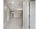 Open hallway leading to living spaces, featuring archways and recessed lighting at 3212 Preserve Dr, Orlando, FL 32824