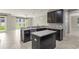 Kitchen showcasing an island, stainless steel appliances, and granite countertops at 3212 Preserve Dr, Orlando, FL 32824