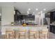 Spacious kitchen with dark cabinets, granite countertops, and stainless steel appliances at 3212 Preserve Dr, Orlando, FL 32824