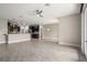 A spacious living room and kitchen feature neutral walls and tile flooring at 3212 Preserve Dr, Orlando, FL 32824