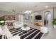 A furnished living room features a striped rug and a view to another room at 3212 Preserve Dr, Orlando, FL 32824