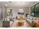 A furnished living room is illuminated by a chandelier at 3212 Preserve Dr, Orlando, FL 32824
