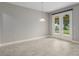 Spacious living room with tile floors, a pendant light, and French doors leading to the yard at 3212 Preserve Dr, Orlando, FL 32824