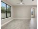 Bright living room with tile flooring, large window, and an adjacent room at 3212 Preserve Dr, Orlando, FL 32824