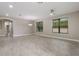 Spacious living room with natural light, tile flooring, and an open floor plan at 3212 Preserve Dr, Orlando, FL 32824