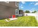 Fenced-in backyard with patio area, offering a private and secure outdoor space at 3221 Bayflower Ave, Harmony, FL 34773