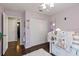 Cozy bedroom featuring bunk beds, a closet and a door to the hallway at 3221 Bayflower Ave, Harmony, FL 34773