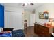 Bright bedroom with a ceiling fan, and a double door closet at 3221 Bayflower Ave, Harmony, FL 34773