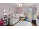 Charming bedroom featuring a bunk bed with vanity and a fluffy white rug at 3221 Bayflower Ave, Harmony, FL 34773