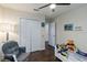 Well lit bedroom featuring a comfortable chair and closet at 3221 Bayflower Ave, Harmony, FL 34773