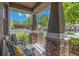 Relaxing front porch featuring comfortable seating and stylish decor at 3221 Bayflower Ave, Harmony, FL 34773