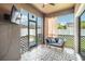 Cozy screened lanai is furnished with a comfortable seating area and features tile flooring at 3221 Bayflower Ave, Harmony, FL 34773