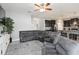 Open concept living room featuring a sofa and adjacent kitchen area at 3221 Bayflower Ave, Harmony, FL 34773