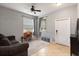 Cozy living room with tile flooring and ample natural light from the window at 3221 Bayflower Ave, Harmony, FL 34773