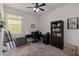 Office space with natural light, a ceiling fan, a desk, and a bookcase for storage at 3221 Bayflower Ave, Harmony, FL 34773
