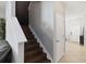 Staircase with hardwood steps and white risers leading to the upper level of the home at 3221 Bayflower Ave, Harmony, FL 34773