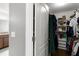 Open closet with clothing racks and shelving for storage, providing organized space at 3221 Bayflower Ave, Harmony, FL 34773