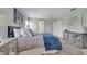 Comfortable bedroom with gray walls, plush bedding, and mirrored furniture at 33 Peterlee Ct, Kissimmee, FL 34758