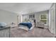 Spacious bedroom with plush carpet, natural light, and modern furnishings, creating a relaxing retreat at 33 Peterlee Ct, Kissimmee, FL 34758