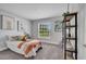 Bedroom with a plush carpet, window view, twin bed, and bookshelf at 33 Peterlee Ct, Kissimmee, FL 34758