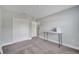 Bedroom with an open door, closet, and desk at 33 Peterlee Ct, Kissimmee, FL 34758