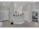 Welcoming foyer leading to an open-concept kitchen with white cabinets and modern design at 33 Peterlee Ct, Kissimmee, FL 34758
