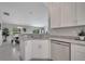Stylish kitchen sink with granite countertops and stainless steel appliances, adjacent to dining area at 33 Peterlee Ct, Kissimmee, FL 34758