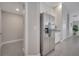 Stainless steel refrigerator with ice maker, complemented by white cabinetry and granite countertops at 33 Peterlee Ct, Kissimmee, FL 34758