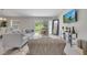 Cozy living room with large windows, modern decor, and comfortable seating arrangements at 33 Peterlee Ct, Kissimmee, FL 34758