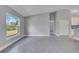 Bright, open living area featuring tile flooring, ample natural light, and neutral paint tones for a modern feel at 33 Peterlee Ct, Kissimmee, FL 34758