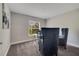 Office space with lots of natural light, glass desk and blue chairs at 33 Peterlee Ct, Kissimmee, FL 34758