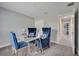 Versatile room with a glass table and three chairs that could be used as an office at 33 Peterlee Ct, Kissimmee, FL 34758