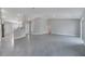 Spacious open floorplan with tile flooring, seamlessly connecting living, dining, and kitchen areas for easy entertaining at 33 Peterlee Ct, Kissimmee, FL 34758