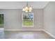 Bright dining area with a view of the backyard, neutral walls, and ceramic tile flooring at 35 Peterlee Ct, Kissimmee, FL 34758